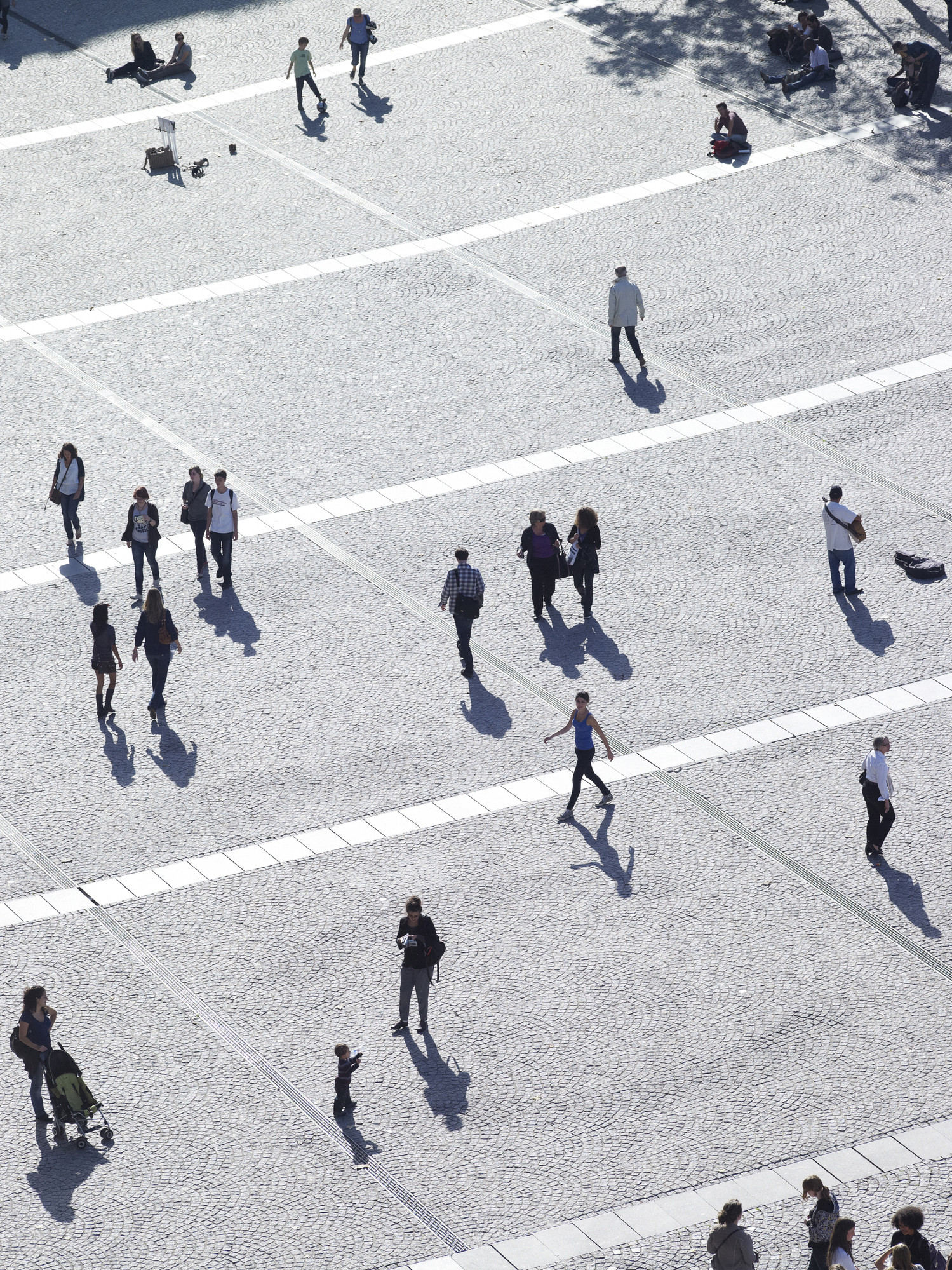 People walking across a plaza