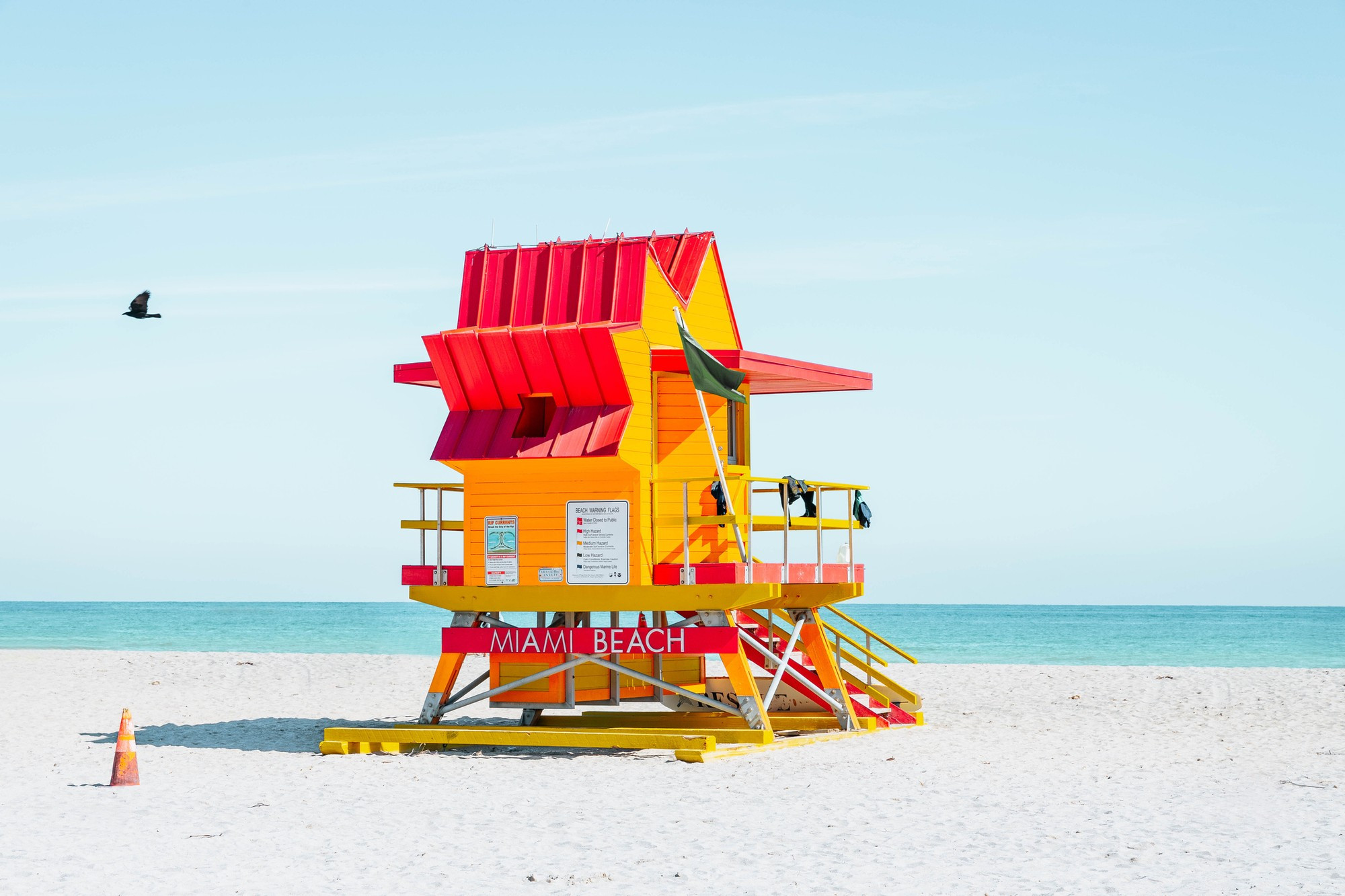 Colorful Miami Beach lifeguard tower with blue sky.