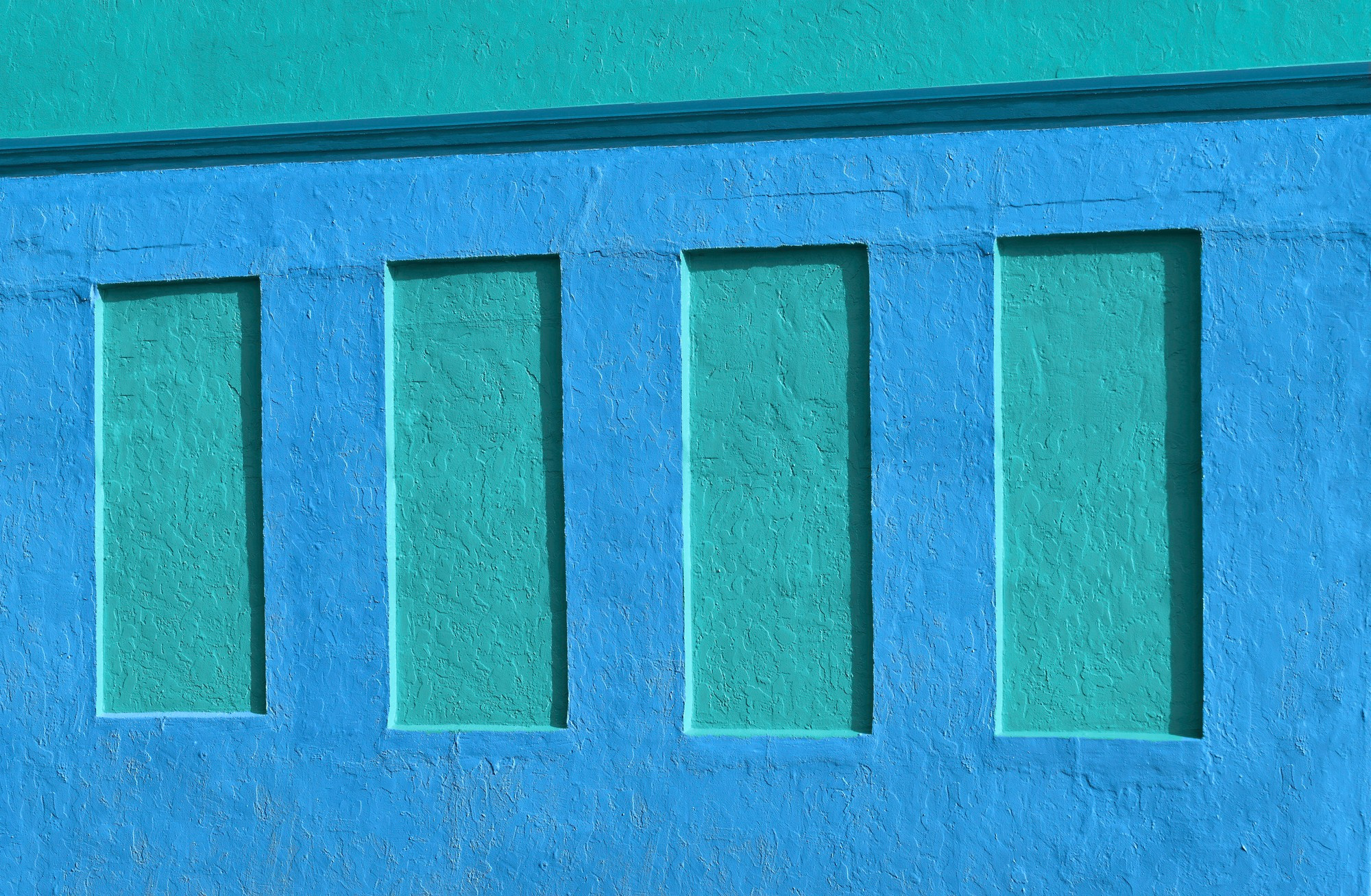 Four Windows Sealed With Stucco