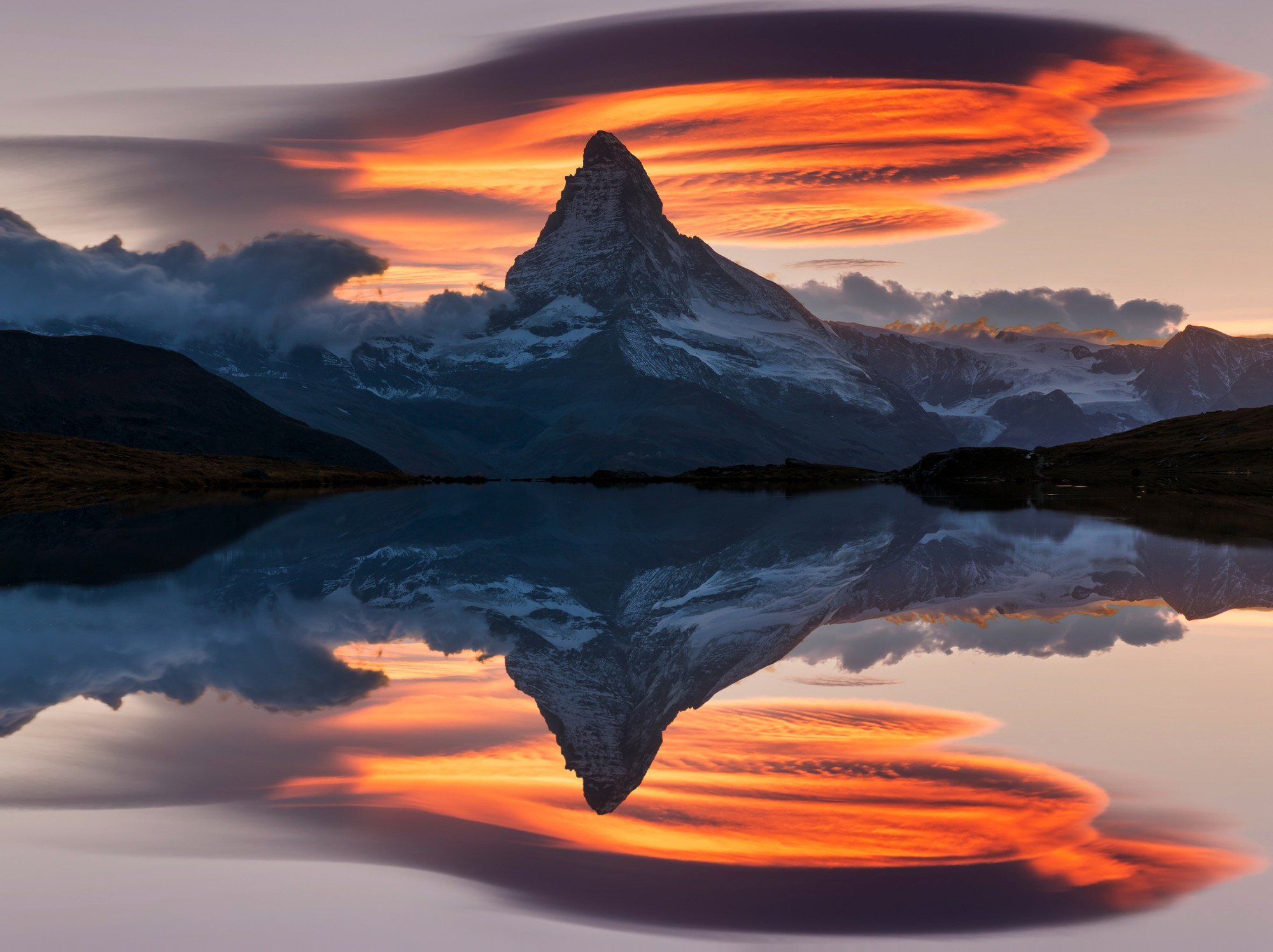 Matterhorn peak at sunset reflected in Stellisee Lake in Zermatt, Switzerland.