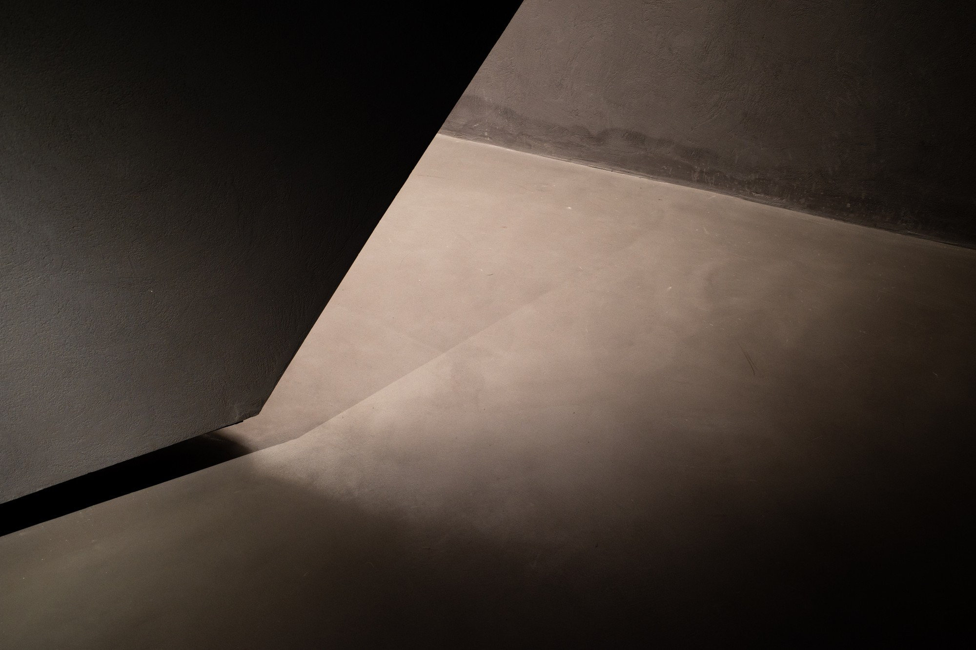 Light and shadow in the corner of gray interior concrete building