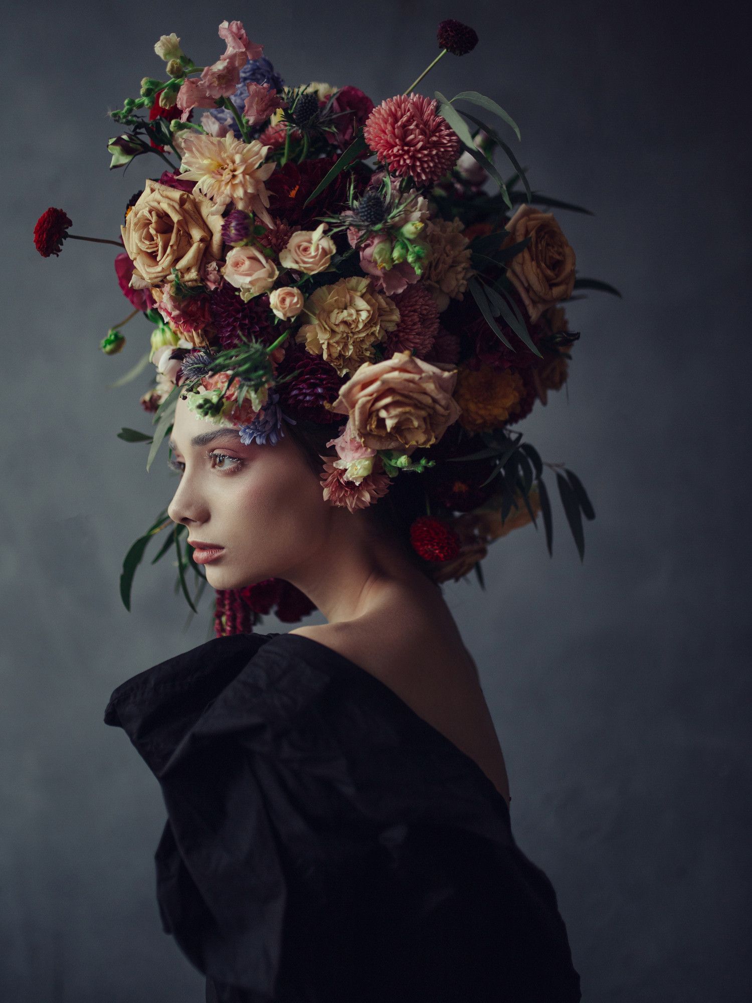 Thoughtful young woman in floral headdress